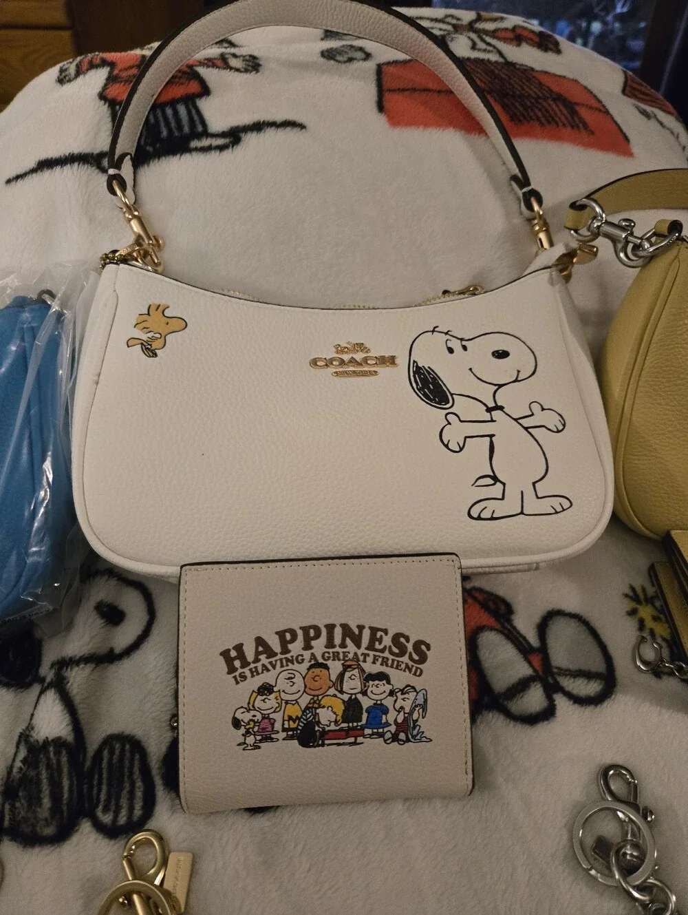 Coach Snoopy Collection Mini Bags & Wallets in White, Yellow, Blue, Cream